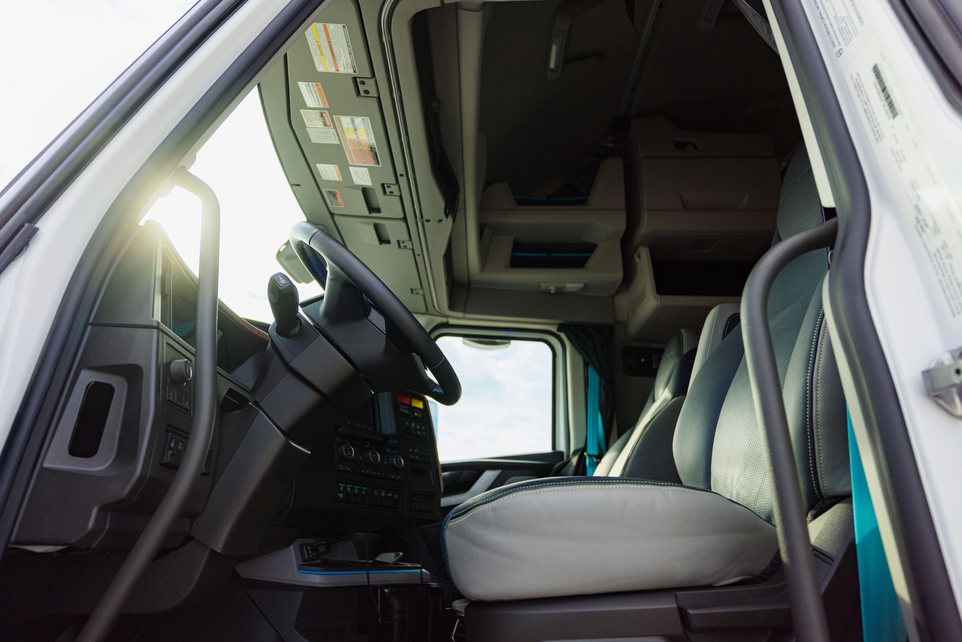 Modern Truck Interior with Driver Seat and Dashboard in Sunlight